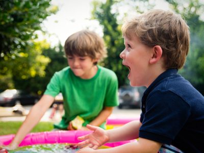 Two boys playing together happily.